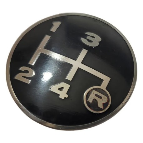 Emblema pomo barra cambios (4 vel. y reversa a la derecha)